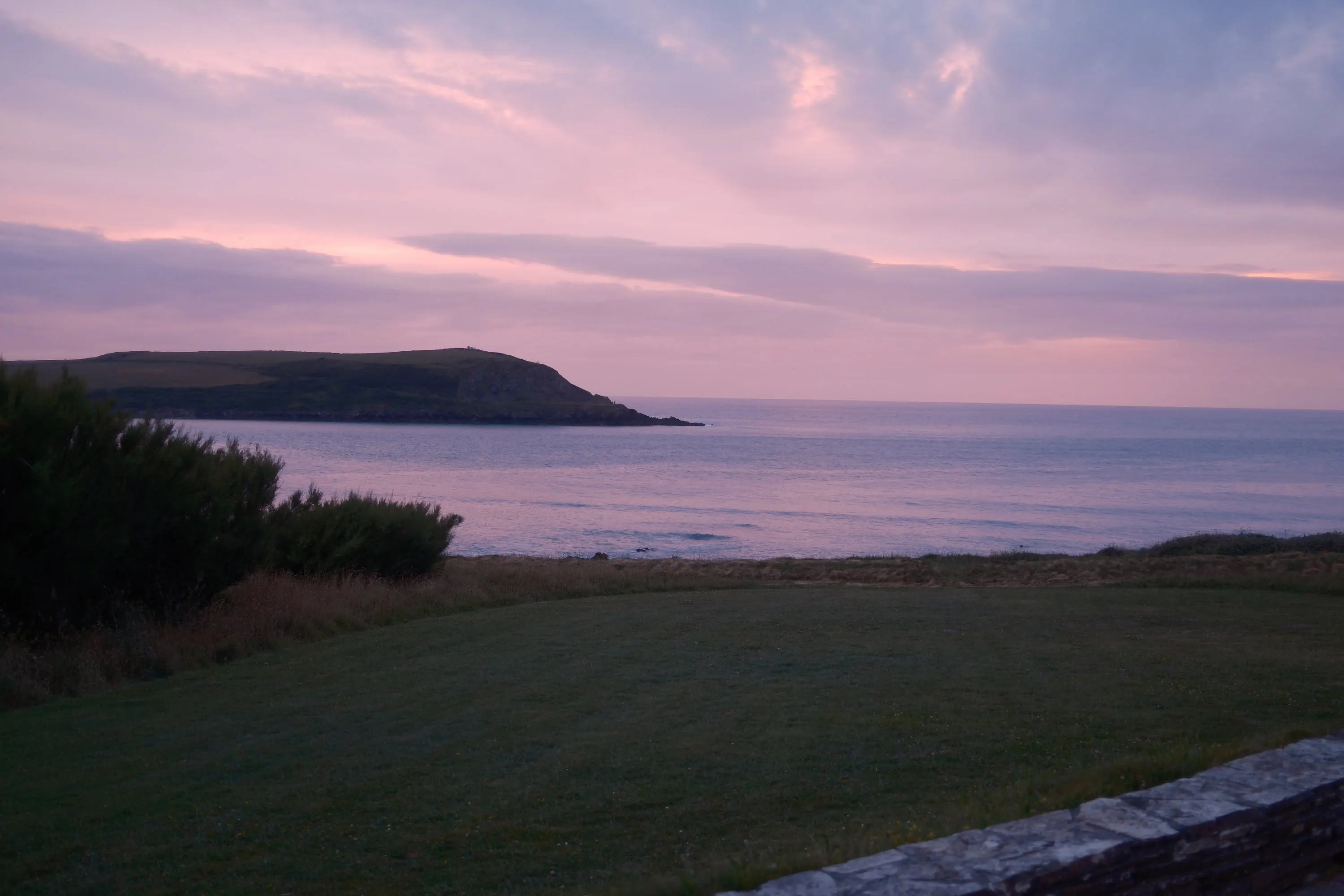Pink going out of the sky over the bay.
